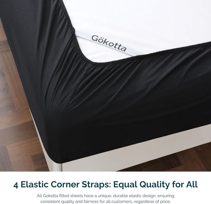 Image highlighting the elastic corner straps of GOKOTTA microfiber fitted sheet for a secure fit.