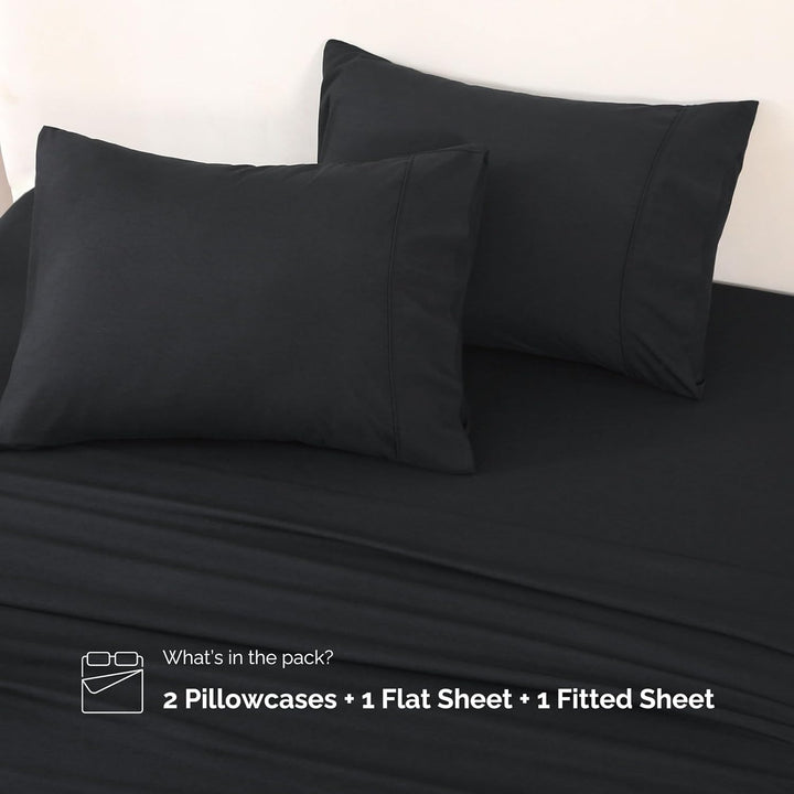 Complete set of GOKOTTA black microfiber sheet set including flat sheet, fitted sheet, and pillowcases.