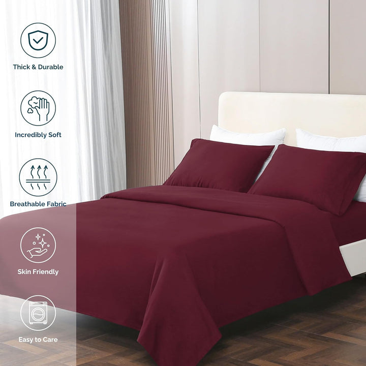 GOKOTTA burgundy sheets beautifully arranged on a well-decorated bed in a cozy bedroom.