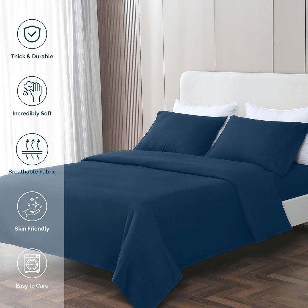 GOKOTTA dark blue sheets beautifully arranged on a cozy bed in a modern bedroom setting.