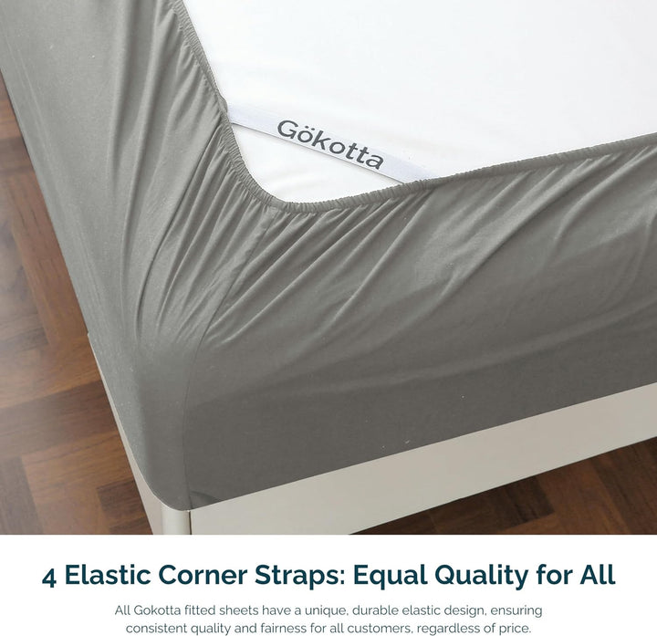 Image highlighting the elastic corner straps on the fitted sheet for a secure fit.