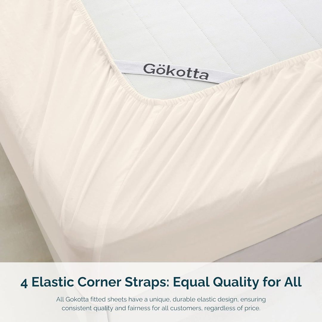 Image showcasing the elastic corner straps on the fitted sheet for a secure and snug fit.